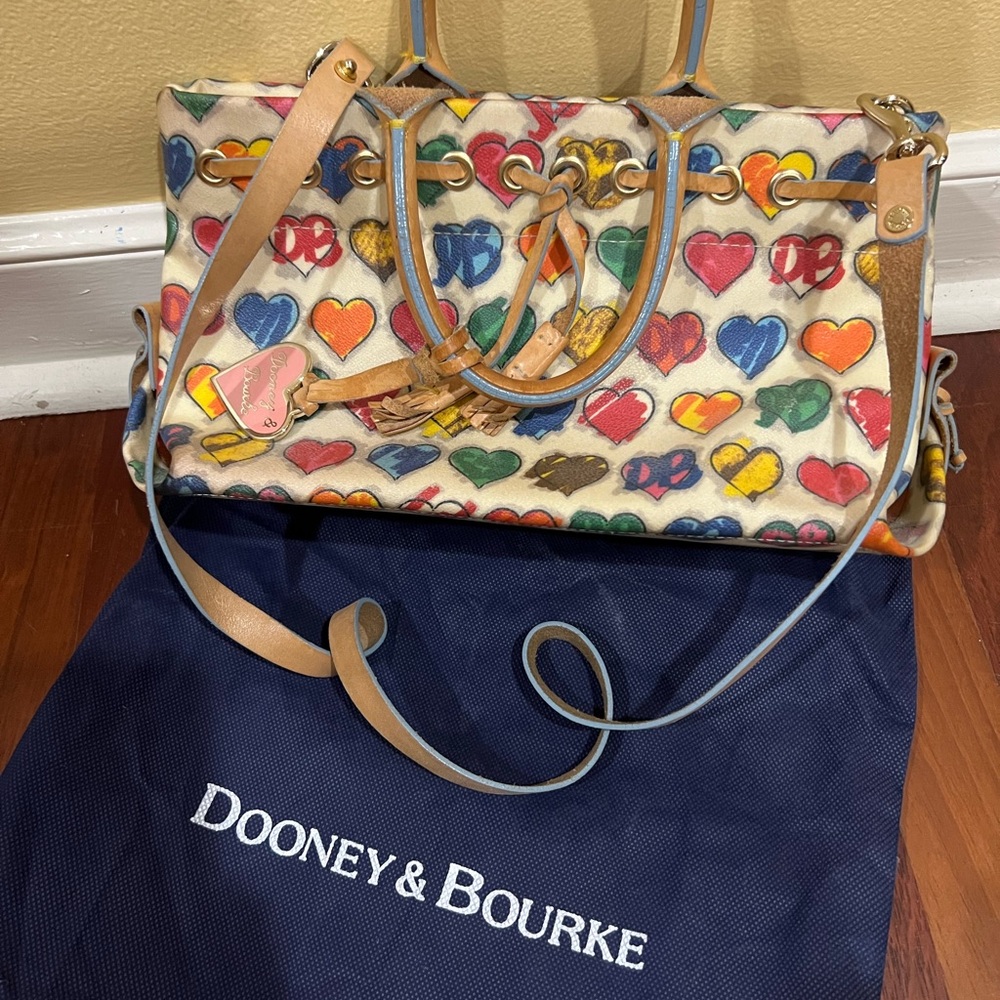 Dooney & Bourke Handbag. Heart print coated canvas, leather handles.